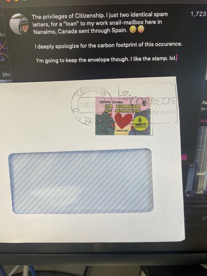 A picture showing one half of an envelop with a plastic window. Above the window is a Spanish stamp In pink and green and blue and yellow. It says “Espana Coorreos Era Humanidad Que Compartimos. (The Humanity we Share) There is a large heart in the middle of a gap representing a bridge over water with land on both sides in green and blue. There is an Amnistia International logo on the right. There are little red heart spread around.

THe stamp is overtop a Valencia Postmark.