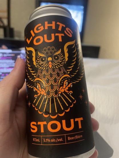 A tall can with a very cool Owl