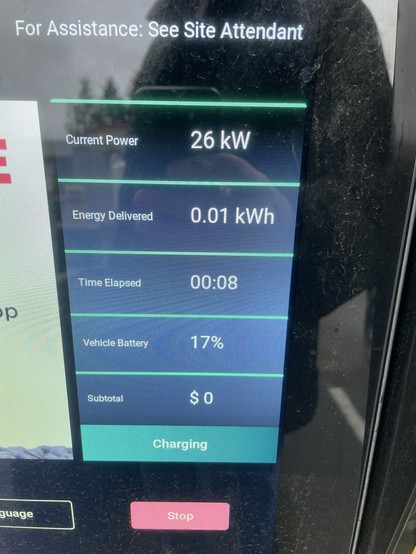 A photo of the charging screen shows 26KW of electricity being delivered, 0.01kWh of energy delivered so far, 8 seconds of time elapsed, the current battery charge is 17% and the price is $0 free.