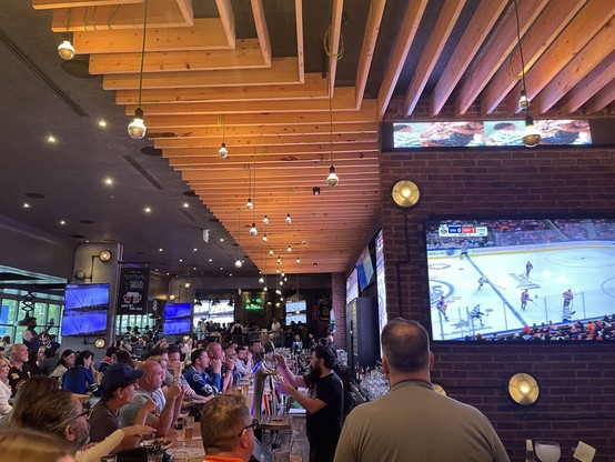 A picture of a packed sports bar.