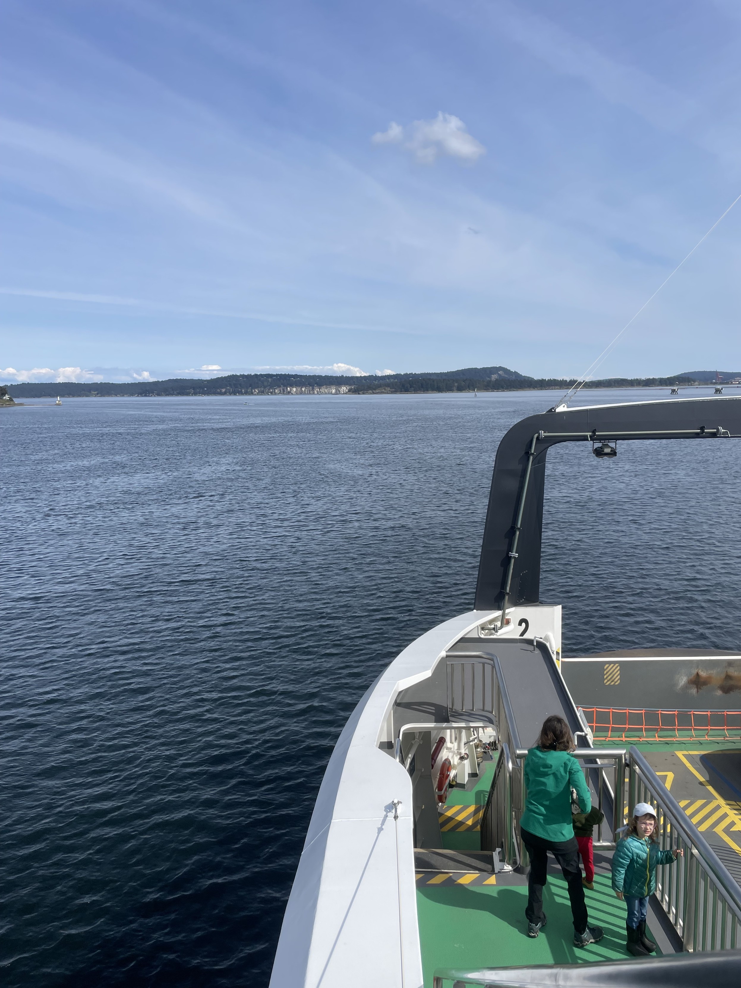 looking out to the front of the ship into the water and island beyond